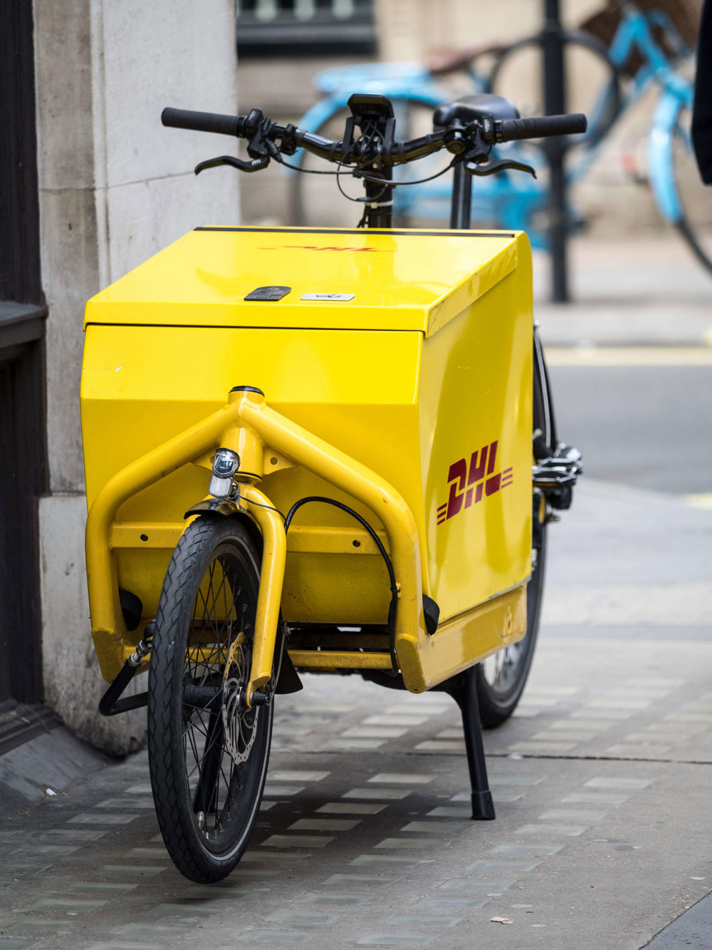 DHL Delivery Bike parked up on the pavement