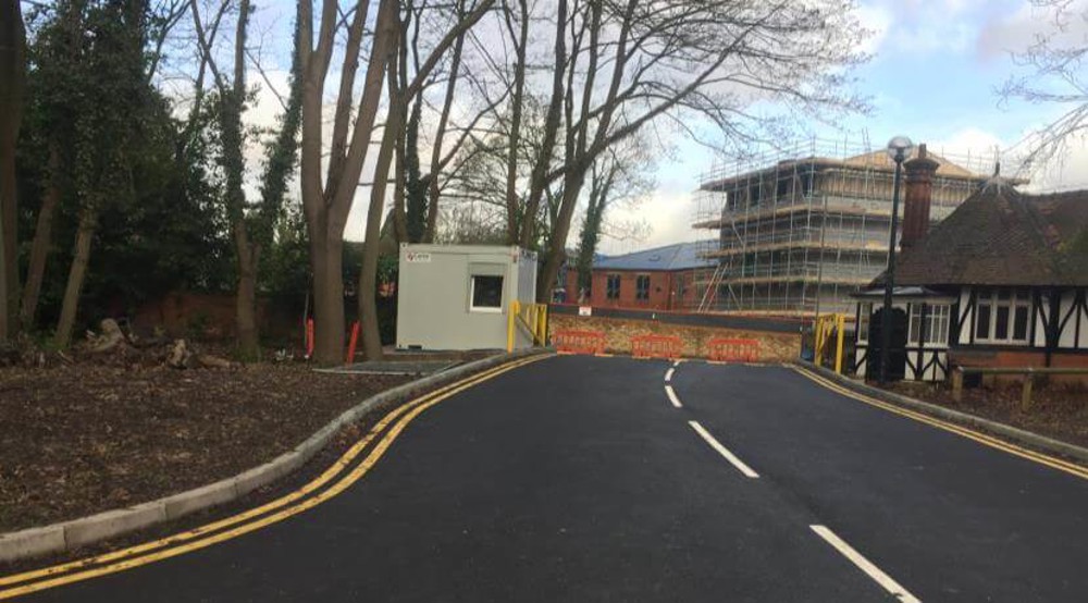 Gardener's Lodge Access Widening & Car Park Works image shows building with scaffold in the background and a tudor style building in foreground