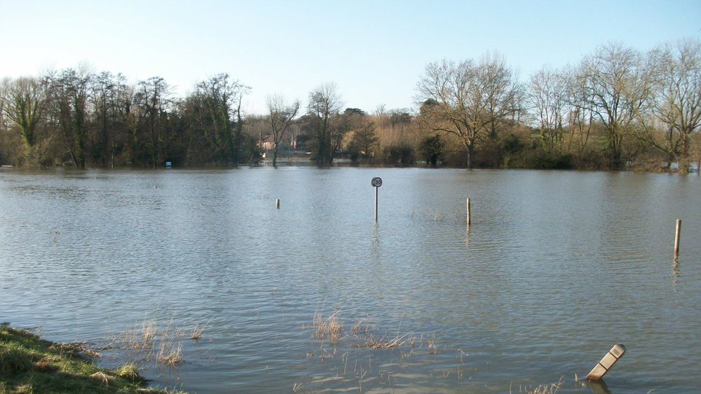A flood risk assessment is needed for areas with high chance of flooding as seen in the photo where an area has flooded.