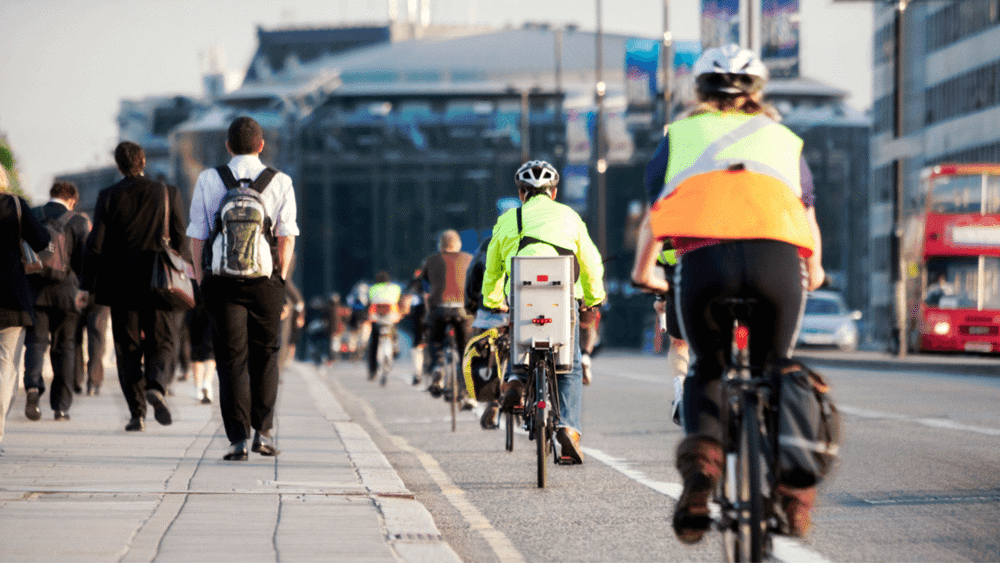Commuters cycling and walking to work in London