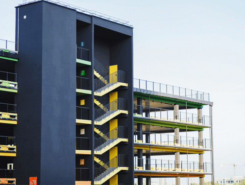 long shot of a multi-story car park with blue and yellow details